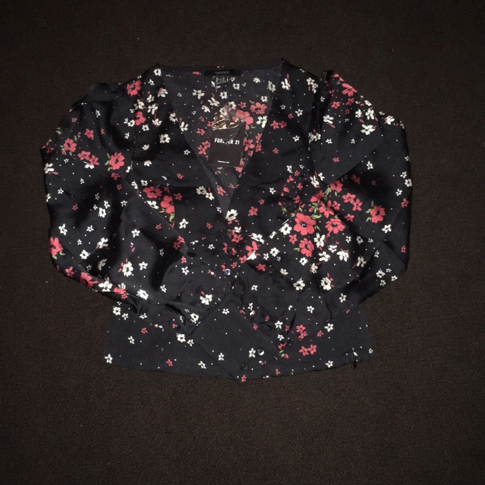 A black long sleeve floral blouse.